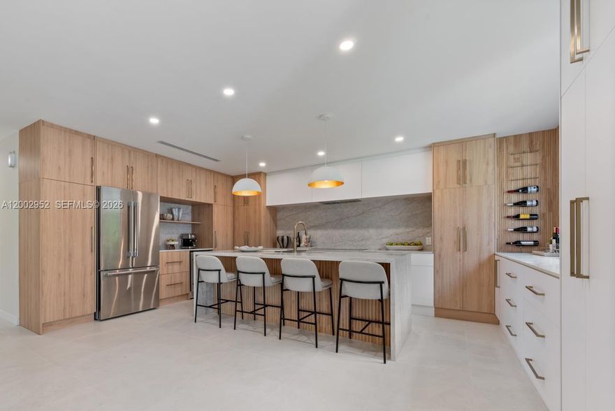 This North Palmetto Bay corner home exudes luxury, with functional and timeless design. Situated on a sprawling 17,300+ SF corner lot framed by mature trees for an elevated indoor-outdoor lifestyle.                                                 The custom chef’s kitchen is a true showpiece, featuring premium Thermador appliances—including an induction cooktop and wine refrigerator—paired with exquisite Taj Mahal quartzite countertops and an expansive island designed for entertaining. The kitchen also offers ample cabinetry and a designated coffee bar.

Sunlit interiors highlight the home’s elegant finishes and thoughtfully designed open living spaces.  Retreat to spacious primary and guest suites, both offering direct access to the covered terrace, ensuite baths and generous closet space. The primary bath has a custom double vanity, with Zellige tile and a built-out closet. 

Relax under the spacious covered terrace and enjoy a backyard that offers plenty of greenspace, built-in fire pit circle, and avocado and mango trees. 

Additional upgrades include all impact windows/doors, PVC plumbing, a new HVAC system and air ducts with linear diffusers, and a partial garage for added flexibility.  Ideally located near Coral Reef Park, top-rated public and private schools, The Falls shopping center, and everyday conveniences, this exceptional property offers the perfect blend of luxury, comfort, and location.