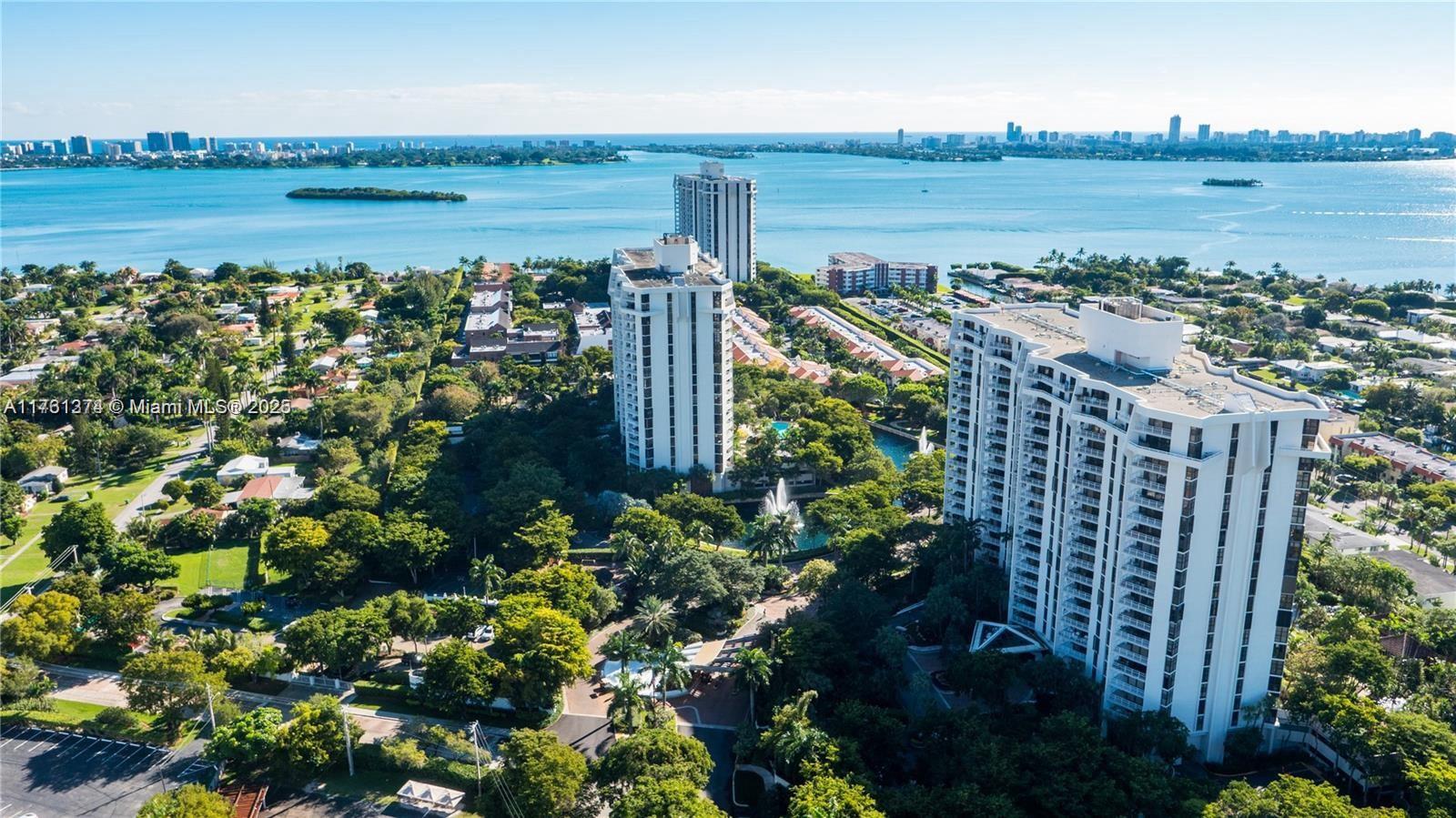 Welcome Home! This resort-style condo is in an excellent area next to Miami Shores, Biscayne Park, MIMO, and US1. The two-bed, two-bath corner unit offers breathtaking skyline and bay views. Upon walking in, you'll see direct views of the city and an open balcony as an extension of your living space, perfect for relaxing and connecting with nature. The unit has stainless steel appliances, a stylish open kitchen, and a living room layout. The unit comes with assigned covered parking in a private luxury gated community with 24/7 security, a spa, eight tennis courts, pickleball, racket, gym, marina, gym, children's park, dog park, free exercise classes, basketball court, cafe, cable and internet included, and restaurant at the marina.