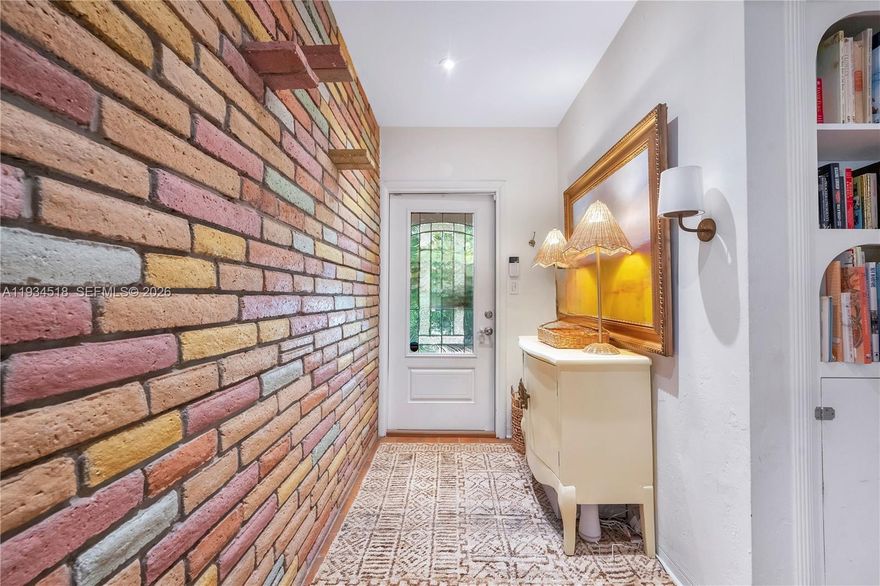 Discover this meticulously renovated Coconut Grove retreat where 1940s character meets modern sophistication. Located on a serene, tree-lined street in the highly sought-after North Coconut Grove, this 2-bedroom, 1-bathroom residence offers approximately 1,059± SF of light-filled living space and a private tropical setting.
The open-concept layout showcases preserved original details, refinished oak parquet floors, and thoughtful interior upgrades that honor the home’s historic charm. The chef’s kitchen features premium quartzite countertops, custom cabinetry, and high-end stainless-steel appliances. Impact-resistant windows and doors enhance energy efficiency and peace of mind.
Situated on a 6,550± SF lot, the outdoor space is designed for the Florida lifestyle, featuring a private heated pool and spa, lush tropical landscaping, a brick-paver patio, open porch ideal for entertaining, attached carport, and paver-block driveway.
Ideally located near Coconut Grove Village, marinas, boutiques, parks, dining, and public transportation, with easy access to Coral Gables, Brickell, and Downtown Miami.