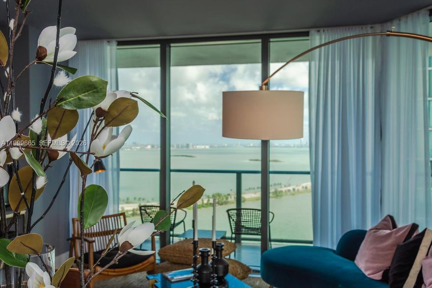 Beautifully designed and decorated corner unit with stunning views of Biscayne Bay. Attention to detail in every room of this gorgeous three-bedroom, ready to move in. Amenities include a state-of-the-art gymnasium, sky pool, summer kitchens, spa, tennis court, kids' room, clubhouse, the Amara Restaurant by award-winning chef Michael Schwartz, and many more. Paraiso Bayviews is in Miami's hottest new area, close to the Design District, Midtown, a few miles from the beaches, downtown Miami, and Miami International Airport. See Broker's Remarks.
