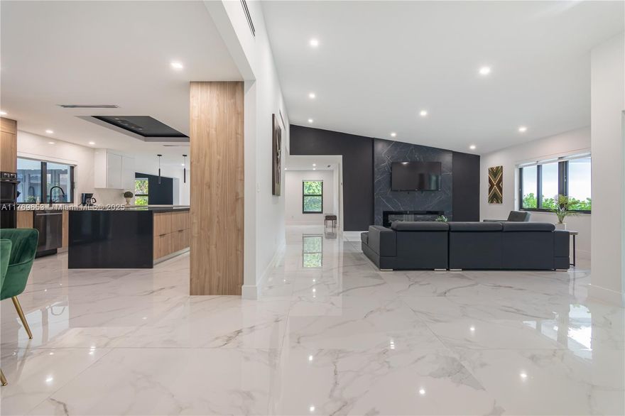 Special financing available! Up to 3% in seller-paid closing costs or a 2/1 rate buy-down with preferred lender. Seller will cover owner’s title policy. Discover modern luxury in the desirable J G Heads neighborhood. This fully renovated 6BR/5BA home welcomes you with soaring vaulted ceilings, an electric fireplace, and a grand layout. Enjoy a chef’s kitchen with quartz counters, Wi-Fi smart appliances, and a spacious island. Porcelain tile floors, smart toilets, and dual Nest A/C systems add sophistication. The primary suite includes a Roman tub, open shower, and walk-in closets. Outdoors: fenced yard, saltwater pool, infinity jacuzzi, covered terrace, and large garage/driveway. Turnkey and exceptional.