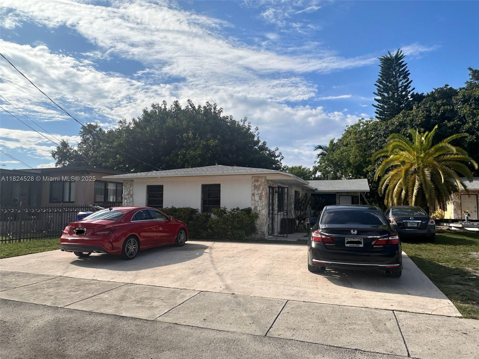 Beautiful newly renovated multi family unit! Don't miss out! Gross rent of $6,300. Three units total: 3/2, 2/1 and 1/1. Multi Family next door also for sale for a total gross rent of $11,400 between both check MLS# A11824581. Nicely renovated units with new kitchens and full quartz backsplash. Stainless steel appliances, dining room, large family room, master bedroom with walk in closet, renovated bathrooms and laundry room/hook up. Porcelain floors, brand new kitchen cabinets on rear units, recently renovated in the front one. Freshly painted and 3 Year old roof with newer central A/Cs. Close to I-95, 112 and Miami International Airport. Long term tenants. Month to month leases. Quiet street. Live in one unit and collect rent from the others. Must see!