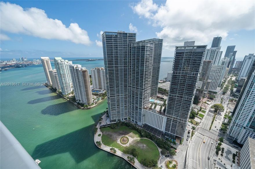 Perched high above Brickell in the iconic EPIC Residences, this exceptional 3-bedroom + den, 3.5-bath residence offers over 2,500 SF of refined interiors and a spacious private terrace with sweeping views of Biscayne Bay and the Miami River.

Floor-to-ceiling glass surrounds the expansive living and dining areas, flooding the home with natural light and showcasing the building’s signature curved façade. The open kitchen is ideal for both everyday living and entertaining, complemented by generously sized bedrooms and a versatile den perfect for a home office or media room.

Designed for both comfort and functionality, the residence features an exceptional amount of storage throughout, including numerous closets, custom-built cabinetry, and thoughtfully integrated storage spaces—an uncommon and highly valuable feature in comparable units.

The primary suite offers a spa-inspired bath and generous closet space, while all bedrooms ensure privacy and comfort.

Residents enjoy access to the luxury amenities of the Kimpton EPIC Hotel—including pools, spa, fitness center, and dining—while benefiting from a completely separate private entrance and residential lobby, ensuring privacy and exclusivity.

Ideally located steps from the best venues Miami has to offer, this is a rare opportunity to own a premier high-floor residence with iconic views.