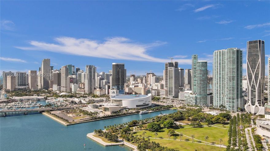 SPECTACULAR MIAMI VIEWS- Enjoy sweeping views of Biscayne Bay, Museum Park, PortMiami, and the Experience Miami Beach skyline from this upgraded 1BD + Den, 2BA at 900 Biscayne Bay Features 10’ ceilings, floor-to-ceiling impact glass, and a spacious private balcony. Porcelain floors, custom millwork, recessed + cove lighting, and a sleek chef’s kitchen with waterfall island. Spa-inspired baths with floating vanities and frameless glass; oversized primary bath with wet-room rain shower. Resort-style amenities include 2 pools, spa, fitness center, clubroom, theater, 24-hour security & valet. 1 assigned parking. 900 Biscayne offers resort-style amenities including two pools, spa, fitness center, residents’ lounge/clubroom, movie theater, 24-hour security and valet. 1 assigned parking.