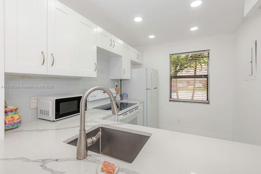 Stunning all remodelled Golf view apto with two bedrooms and 2 bathrooms, new Porcelain tile in bathrooms and waterproof vinyl flooring in the other areas, new white kitchen cabinets, new stainless-steel sink, modern quartz counter tops, washer/dryer hook up. Parking space #25, is in front of unit. Internet/TV-Cable included in assn. fee and already installed. Ready to move in. HOA takes 4 week for approval process, 700+ credit, single income $37.5k, this one won't last at this price, must see it! close to Sawgrass mills mall, restaurants, plazas, highways I-75, sawgrass expressway, 595.