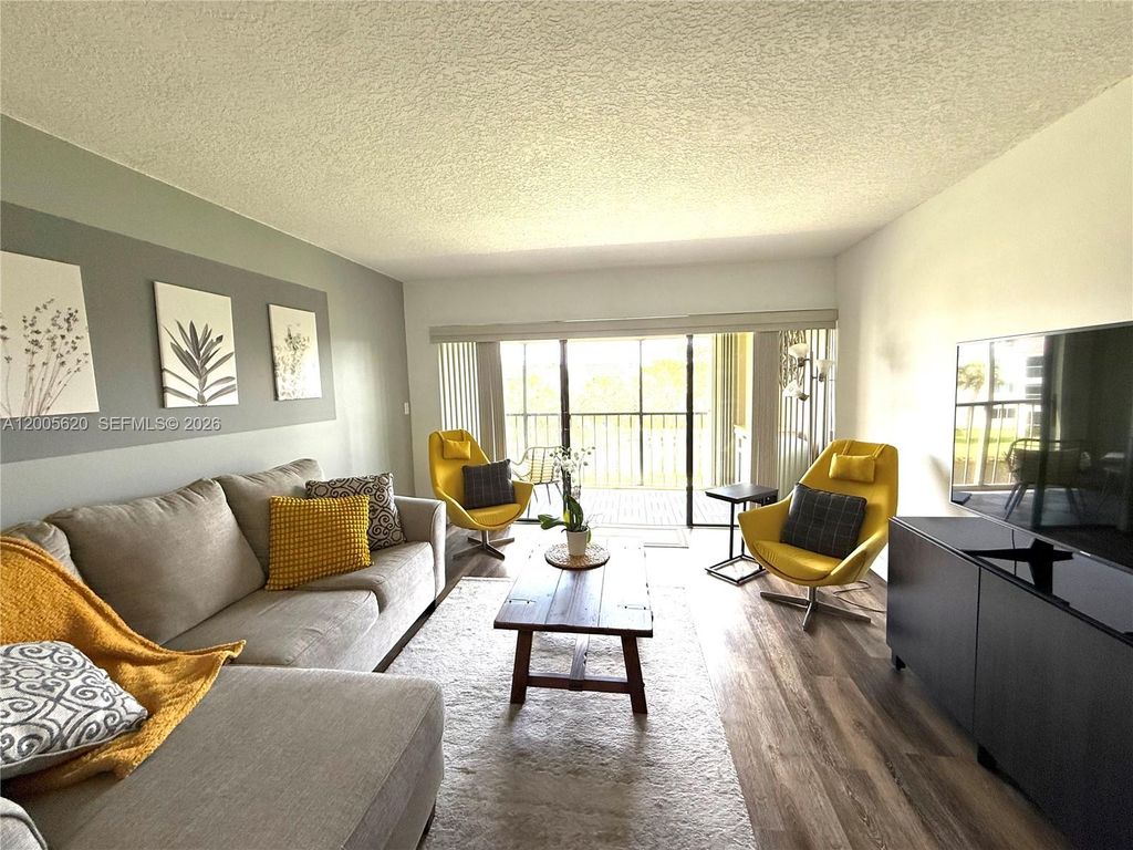 Photo of 230 Lakeview Dr #307, Weston, FL 33326 (MLS # A12005620)