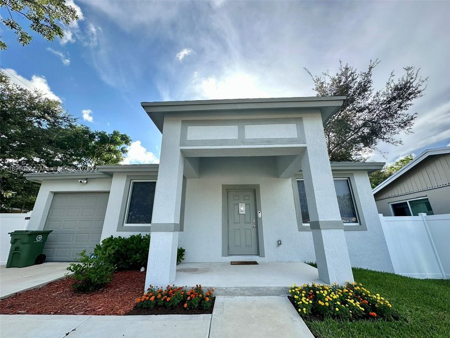 Built in 2022, this modern CBS smart home combines quality, comfort, and design. Hurricane-impact windows, doors, and garage, plus 9 ft ceilings that enhance its open layout. The 3-bedroom, 2-bath floor plan features a full-size laundry area and spacious bedrooms with room for a desk or sitting space. The kitchen offers granite counters, wood cabinets, and Samsung energy-efficient appliances. Smart-home technology includes ADT security, cameras, thermostat, lighting, and keyless entry. Outdoor living shines with a 15x15 patio, firepit, and fenced yard with white PVC fencing, perfect for entertaining or relaxing. Additional features include motion lighting, sprinkler system, and full camera coverage. Near Las Olas, Downtown Fort Lauderdale, the beach, airport, and top-rated schools.