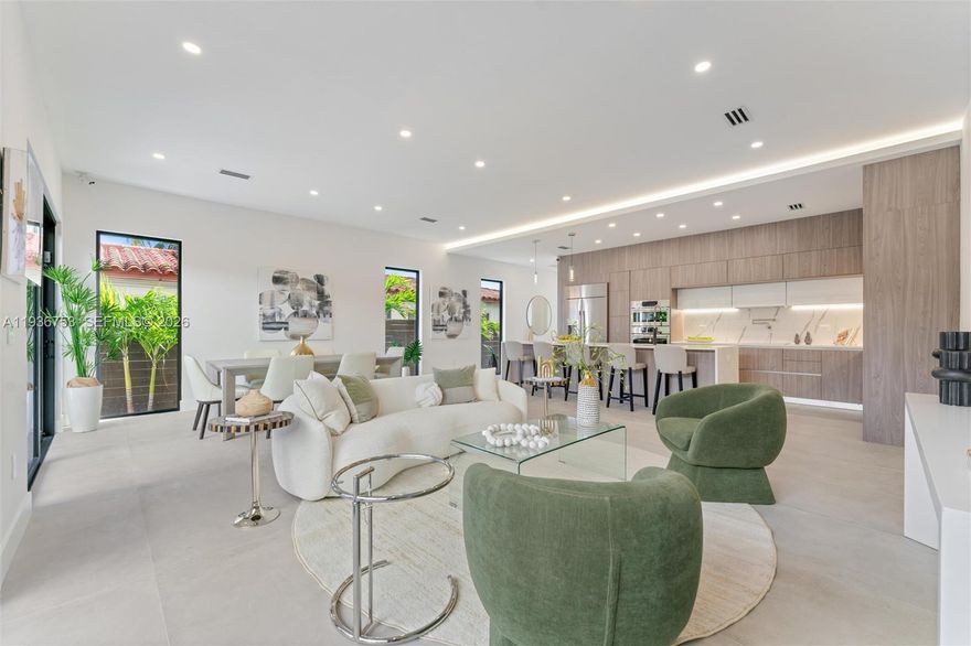 Newly constructed modern residence in the heart of Fort Lauderdale’s desirable Coral Ridge neighborhood, offering refined design and effortless indoor-outdoor living.  This 2,557 square foot home features 4 bedrooms, 5 bathrooms, a private den, and a full-size laundry room. Sun filled interiors showcase soaring ceilings, walls of glass, sleek flooring, quartz countertops, and curated designer finishes throughout.  The chef’s kitchen is anchored by an oversized island and outfitted with premium Dacor and Bosch appliances, flowing seamlessly to the poolside terrace for everyday living and entertaining.  Outdoor living is taken to the next level with a private pool and an expansive rooftop terrace complete with a summer kitchen, jacuzzi ready hookups, and panoramic skyline and sunset views.  Ideally situated just minutes from Fort Lauderdale Beach, Galleria Mall, Las Olas Boulevard, and premier dining and shopping, with easy access to downtown Fort Lauderdale and major roadways.