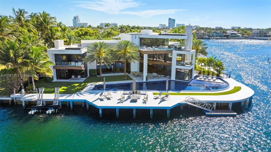 Welcome to the pinnacle of luxury in prestigious Harbor Beach, a guard-gated waterfront community offering ultimate privacy and exclusivity. This extraordinary point lot estate boasts +/- 300’ of prime waterfront with sweeping Intracoastal views. Designed for the most discerning buyer, the tri-level residence blends timeless elegance with modern sophistication—featuring soaring ceilings, custom closets, rich wood and marble finishes, smart home technology, 4 fireplaces, 6 wet bars, and a commercial-grade elevator. The top-floor lounge offers some of the most breathtaking views in the city. Enjoy the infinity-edge pool, entertain on the waterfront terrace, or cruise from your private dock.