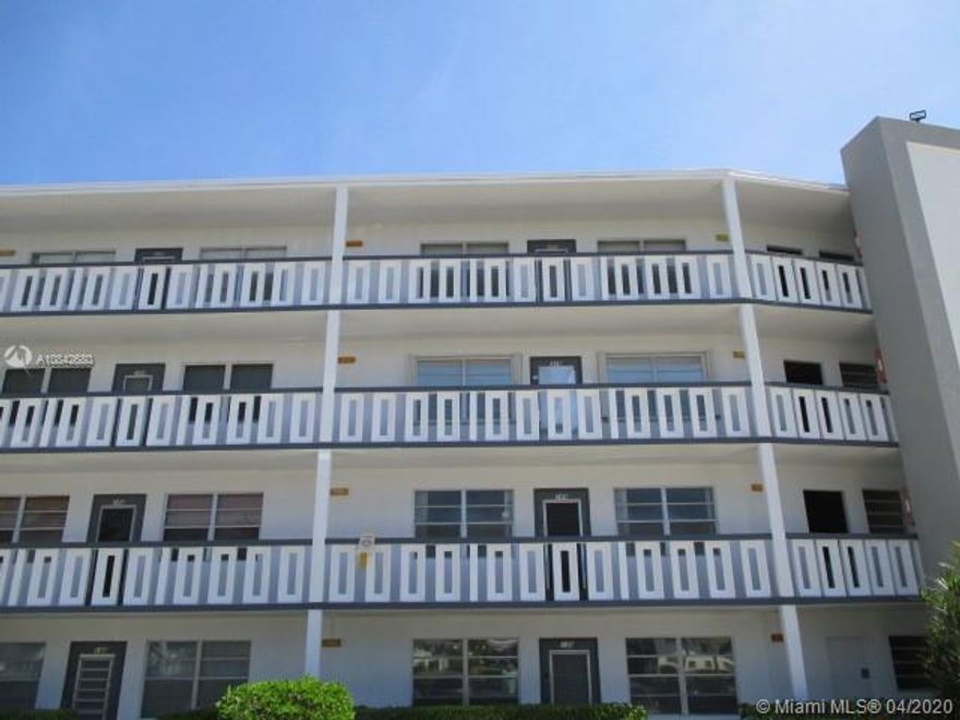 2 bed 2 bath 2nd floor unit in Century Village.  Nice lake view from enclosed patio.  Great opportunity.