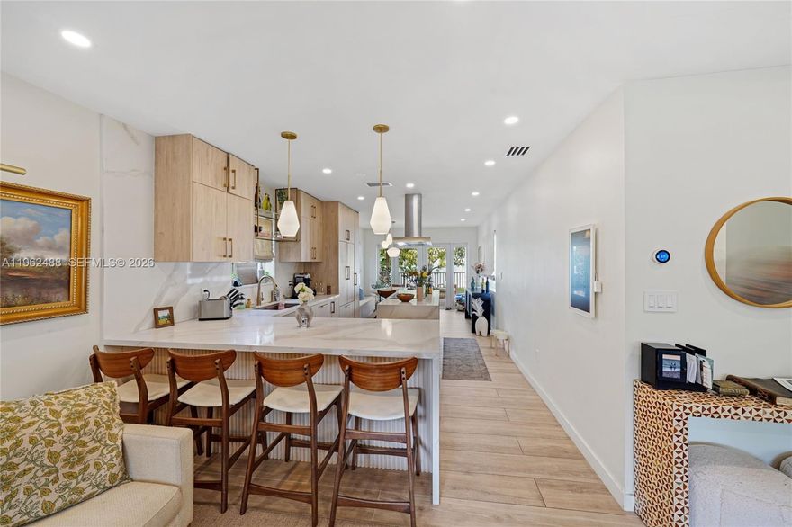 Fully upgraded and thoughtfully designed, this stunning 2-bedroom, 1-bath residence offers a rare blend of modern comfort and style. The home features high-quality finishes throughout, an updated kitchen with contemporary cabinetry and appliances, and a beautifully renovated bathroom. Open, light-filled living spaces create a welcoming atmosphere, with attention to detail evident in every upgrade. Approved plans are in place to expand the home by adding an additional bedroom and bathroom, offering immediate value and flexibility for future growth. The spacious lot provides plenty of room to add a pool. Ideal for end users or investors seeking a turnkey property with expansion potential, conveniently located near shopping, dining, and major roads.