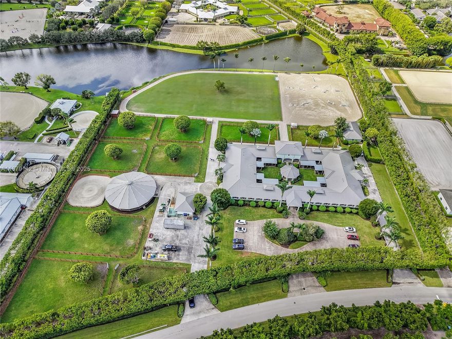 Exceptional equestrian estate located in the prestigious Grand Prix Village, just steps from the bridle path with direct access to Wellington International, the renowned home of world-class horse shows. This 38-stall farm is a rider's dream, featuring a 6-horse walker, a grass riding ring, a fiber/sand ring complete with a full set of jumps, and a track encircling both arenas. Additional amenities include 9 spacious grass paddocks, multiple feed rooms, tack rooms, wash racks, grooming stations, a Ferrier station, and dedicated owner’s quarters. The property also offers three residential units, including groom apartments, providing ample accommodation. Perfect for equestrian enthusiasts seeking unparalleled luxury and convenience.