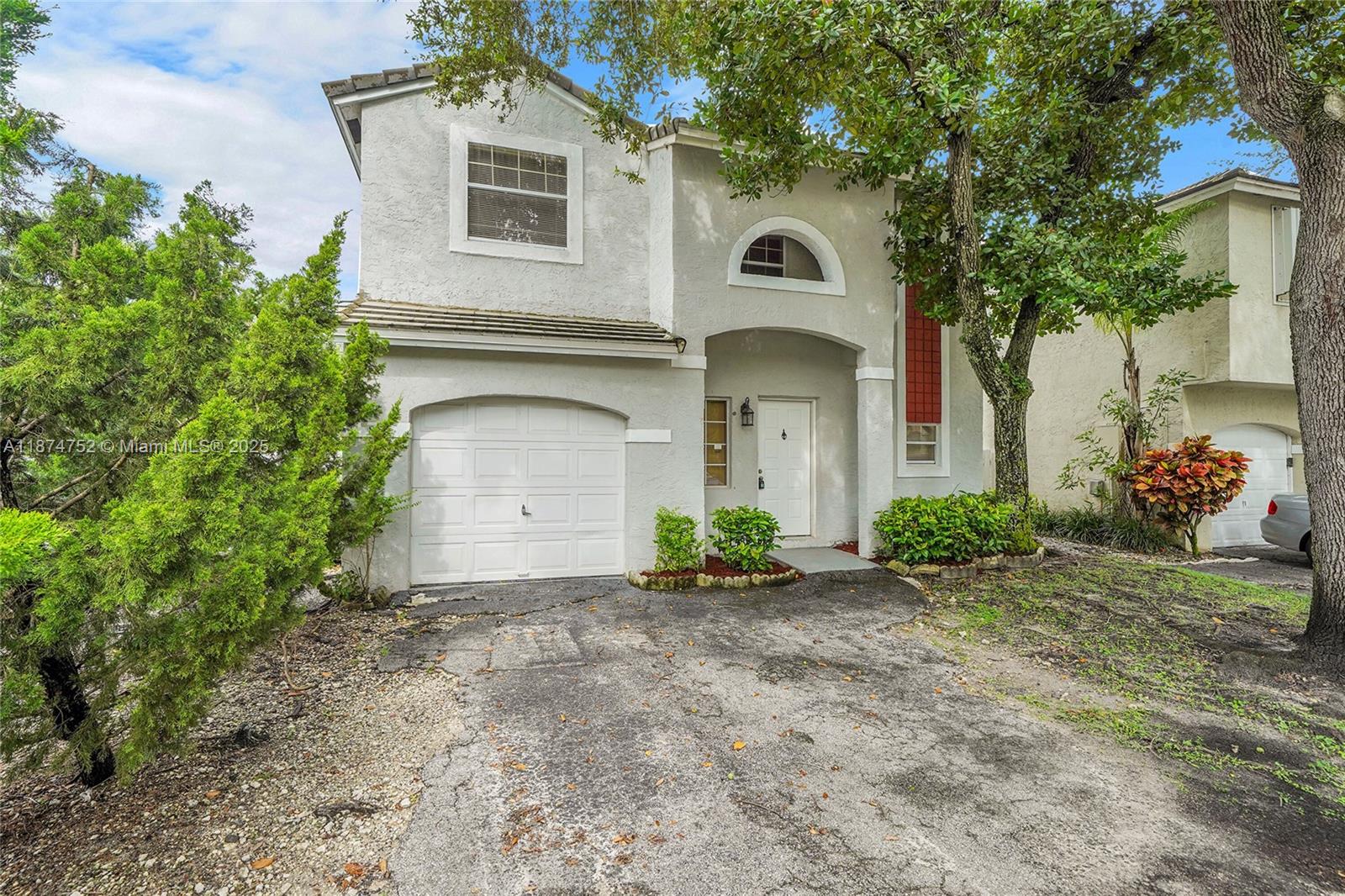 This beautifully maintained 3-bedroom, 2.5-bathroom single-family home located the heart or Plantation. This home offers a comfortable and functional layout, perfect for everyday living. Enjoy year-round comfort with a brand-new A/C unit, and take advantage of the half garage that provides ample storage space for your needs. The spacious primary suite features its own private bathroom, while the two additional bedrooms are generously sized and share a well-appointed full bath. A convenient half bath is located on the main level for guests. Outside, the private backyard offers a great space to relax or entertain. Located close to schools, parks, shopping, and major highways, this home is move-in ready and offers both convenience and value.