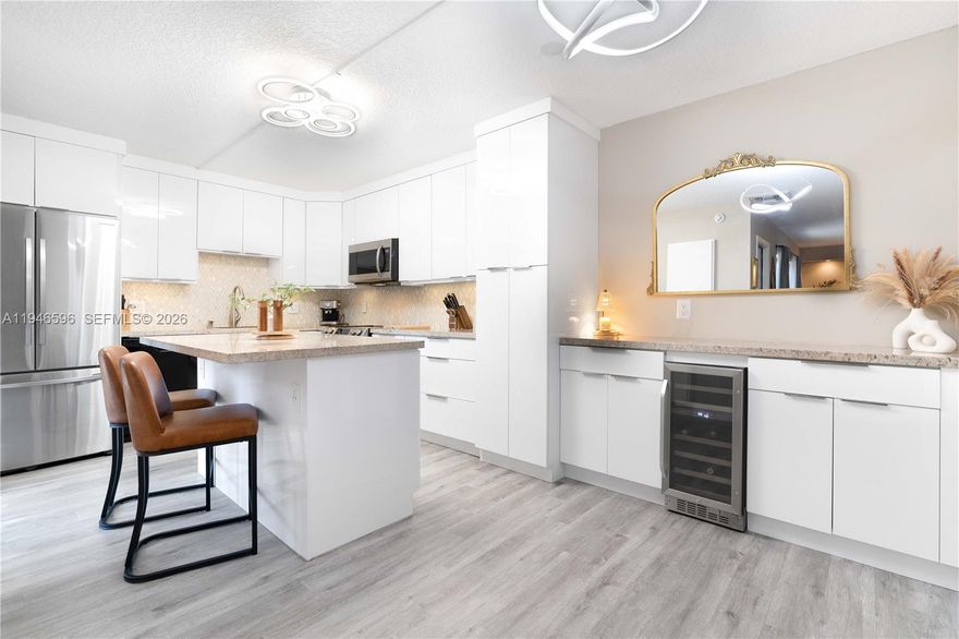 Nestled in the heart of Plantation, this exquisite townhome offers a luxurious and contemporary living experience featuring a very private fenced in tree lined courtyard oasis! The gourmet kitchen is a chef's delight, featuring stainless steel appliances, sleek cabinetry, ample counter space, and a convenient center island. Complete IMPACT WINDOWS. All new bathrooms with granite countertops, brand new flooring throughout the entire residence! Full washer and dryer. HOA monthly fee includes your ROOF, your home's outside perimeter fence, exterior walls and door, plus Xfinity basic cable. Amenities include a Swimming Pool, Resident Car Wash, Guest Parking, and an Onsite Groundskeeper. CONDO DOCUMENTS ATTACHED TO LISTING. Don't miss the opportunity to make this stunning property your own.