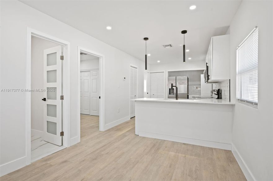 Price improvement. Amazing opportunity!!!. Newly remodeled and upgraded 3 bed/2 bath cozy home. New roof 2025, impact windows, impact glass front door, new kitchen cabinets with quartz countertops and SS appliances, just renovated, new vinyl floors, new central A/C, fenced property, modern look interior doors, impressive patio with new grass. Great investor opportunity as well with the possibility of purchasing 1842 NW 67th St which is next door property and add to portfolio 2 properties ready to rent. Larger than record!