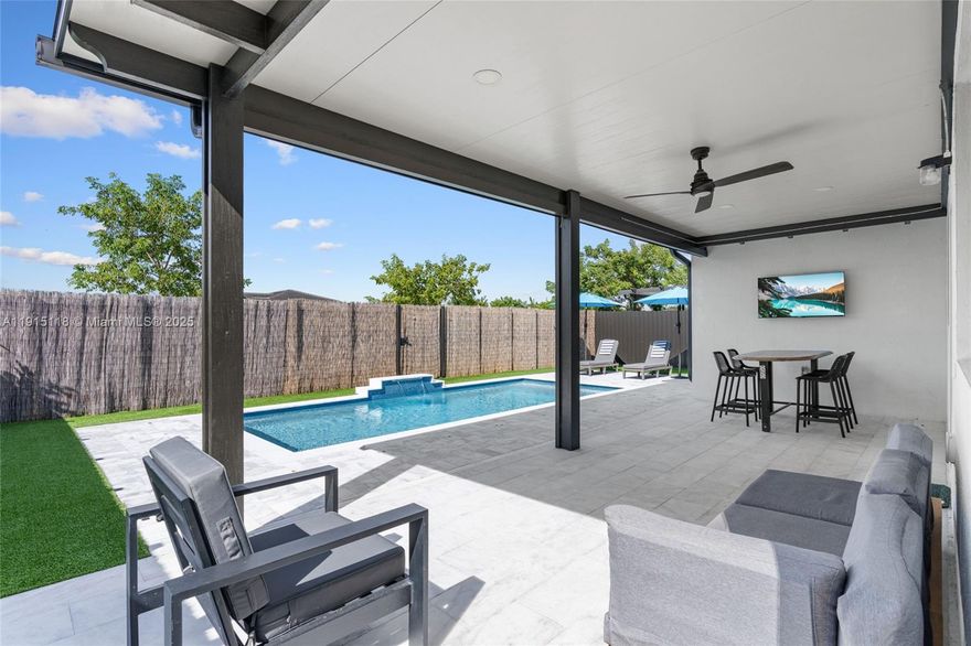 PRICED TO SELL - MOTIVATED SELLER! Stunning turn-key Napoli model on a premium lot with a private in-law suite! This beautifully upgraded home sits in a highly sought-after community and includes a full legal suite with its own entrance, kitchen, bath, living room, and bedroom—ideal for guests, multigenerational living, or rental income. The main home features a grand foyer, open-concept layout, and a chef’s kitchen with custom cabinetry, large island, new first-class appliances, and premium finishes. Upgrades include new porcelain tile downstairs, pro-grade laminate upstairs, and a resort-style backyard with a new saltwater pool, electric patio shade, artificial turf, and marble pavers. A new 2022 roof, spacious two-car garage, no rear neighbors, and extra guest parking behind the property complete this exceptional home.