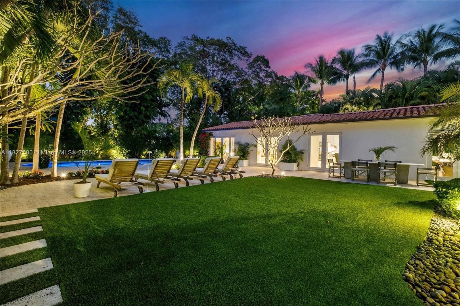 Exquisite colonial masterpiece in the prestigious private gated community of Bay Point. This luxurious tropical oasis blends colonial charm with modern sophistication, offering an unparalleled living experience. Tastefully reimagined, the residence features 4 ensuite bedrooms, dedicated office/ nursery, powder room and oversized laundry/ utility room. The thoughtfully designed split floor plan enhances flow within the expansive 4,050 SF of living space, bathed in natural light that highlights exquisite designer touches. On a generously sized lot, enjoy lush landscaping, pool, large deck and summer kitchen. Located on a quiet inner street with 24/7 security and private roads. Steps away to the Design District, shopping, dining, the beach, Downtown, Brickell, A+ Schools and the MIA airport.