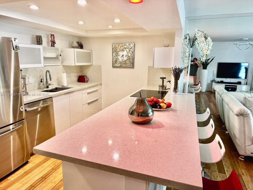 Live in the heart of Three Islands, just minutes away from beautiful beaches, Aventura, and everything you love about South Florida living! This stunning townhouse offers the perfect blend of comfort and convenience with an unbeatable location. Open Concept Floor Plan are spacious and inviting, ideal for modern living and entertaining. Enjoy outdoor living with a covered patio with a lounge area and a gas grill for BBQs, whether you're hosting guests or having a quiet evening. Unwind in the well-maintained community pool and sauna just steps away from your front door. Park across the street is perfect for activities and enjoying the great outdoors. Fully furnished with designer furniture and brand-new appliances, and featuring a new A/C. Nearby is the bay and 2 tennis courts