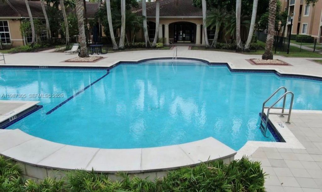 Photo of 8000 N Nob Hill Rd #107, Tamarac, FL 33321 (MLS # A11987305)