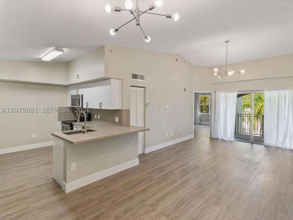 Photo of 155 NW 96th Ter #2-303, Pembroke Pines, FL 33024 (MLS # A12078681)