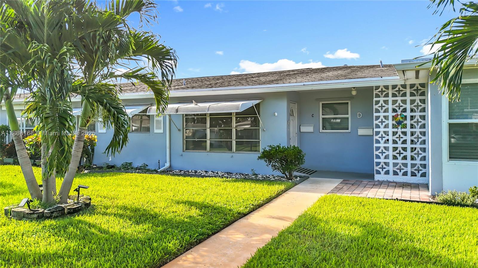 Welcome to this beautifully maintained 1-bedroom, 1.5-bath villa located in the sought-after 55+ community of High Point West. Offering 954 sq. ft. of comfortable living space, this home is spotless and ready for immediate occupancy. The bright interior features tile floors, an open living and dining area, and a kitchen with abundant cabinet storage. A spacious primary suite includes a walk-in shower for easy accessibility, while the enclosed Florida room offers flexibility for a home office, den, or guest space. Large windows invite natural light and garden views throughout. Hurricane panels, ample parking, and guest spaces add peace of mind and convenience. Ideally situated near shopping, dining, and major roadways, this home combines comfort, value, and lifestyle.