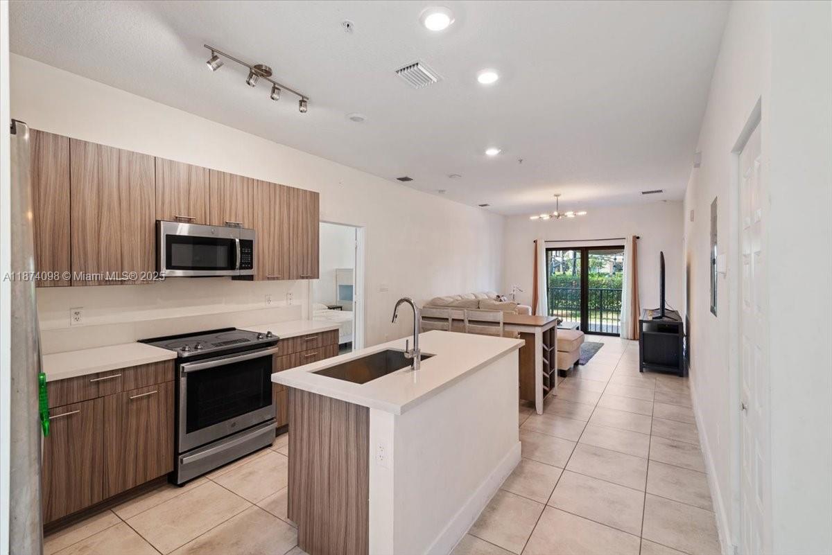 Gorgeous first floor 2 bedroom 2 bath apartment for rent in the most desirable area of Doral; with two separate entrance, including a Next Gen private entry Suite/Studio with own bathroom and kitchenette, with 2 ring cameras and smart locks on the doors; balcony with playground and corner lake views. Quartz kitchen countertops, all ceramic tile floors, stainless steel appliances, open concept living area, impact windows, smart home system. Washer & Dryer inside the unit. Close to A+ schools, restaurants, supermarkets, retails and more. Property located on the 1st floor. Community offers resort style pool, clubhouse, fitness center, playgrounds, pools, a business center, indoor basketball courts, mini golf, dog park and more. Two assigned parking spaces.