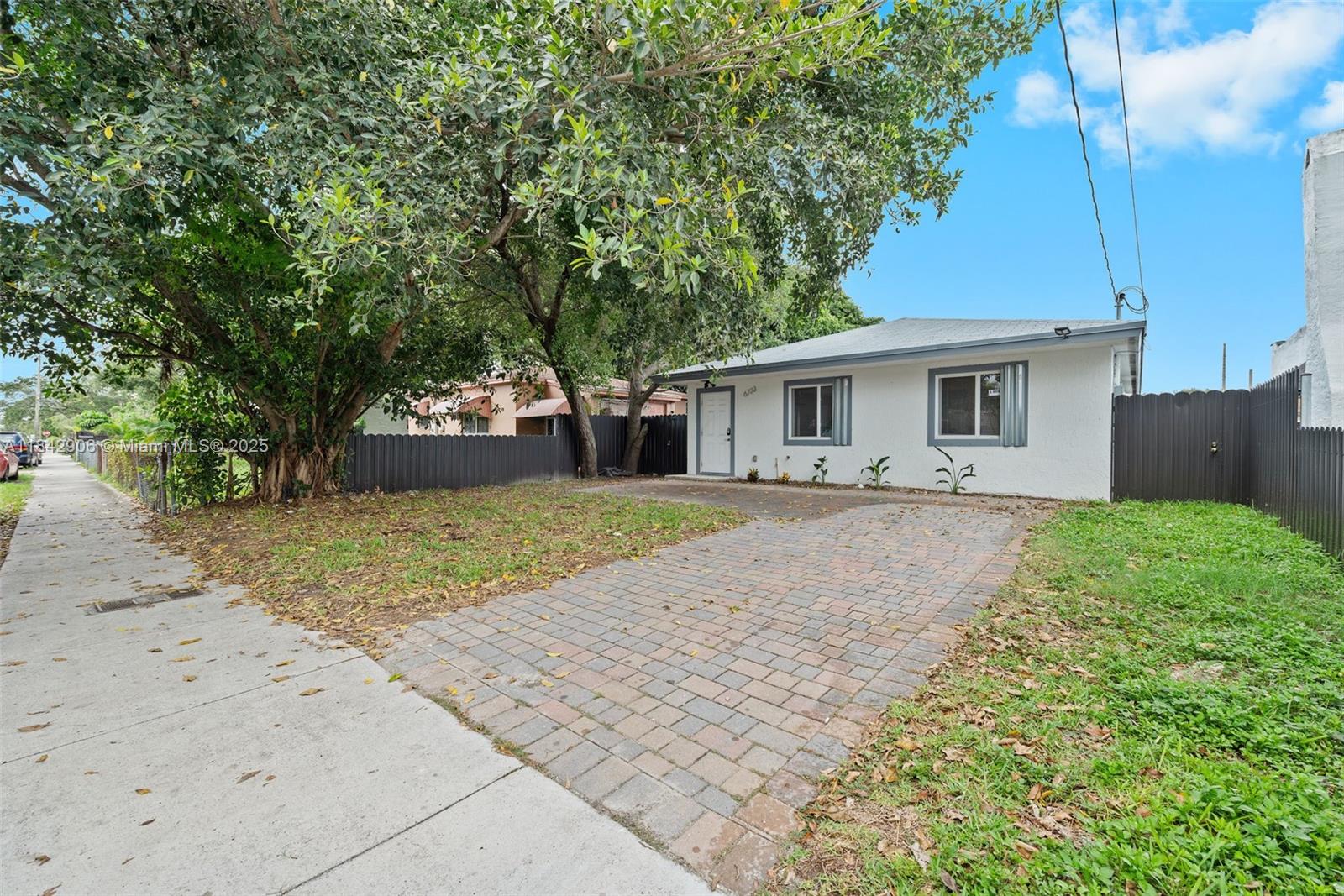 Welcome to this 4-bedroom, 2-bathroom single-family home in one of Miami’s fastest-growing urban neighborhoods, just minutes from I-95 off NW 6th Ave. Built in 2022, this newer-construction home offers easy access in every direction—North, South, East, and West—plus close proximity to top dining, shopping, and entertainment. Inside, enjoy light and bright simple clean finishes and open layout that makes sense. All interior space is efficiently utilized making the home feel larger than the actual square footage. Outside, a fully fenced yard features a hardscaped patio with a cozy seating area and plenty of green space. Special financing incentives for first -time buyers for this location and we can also help with down-payment assistance options for qualified individuals.