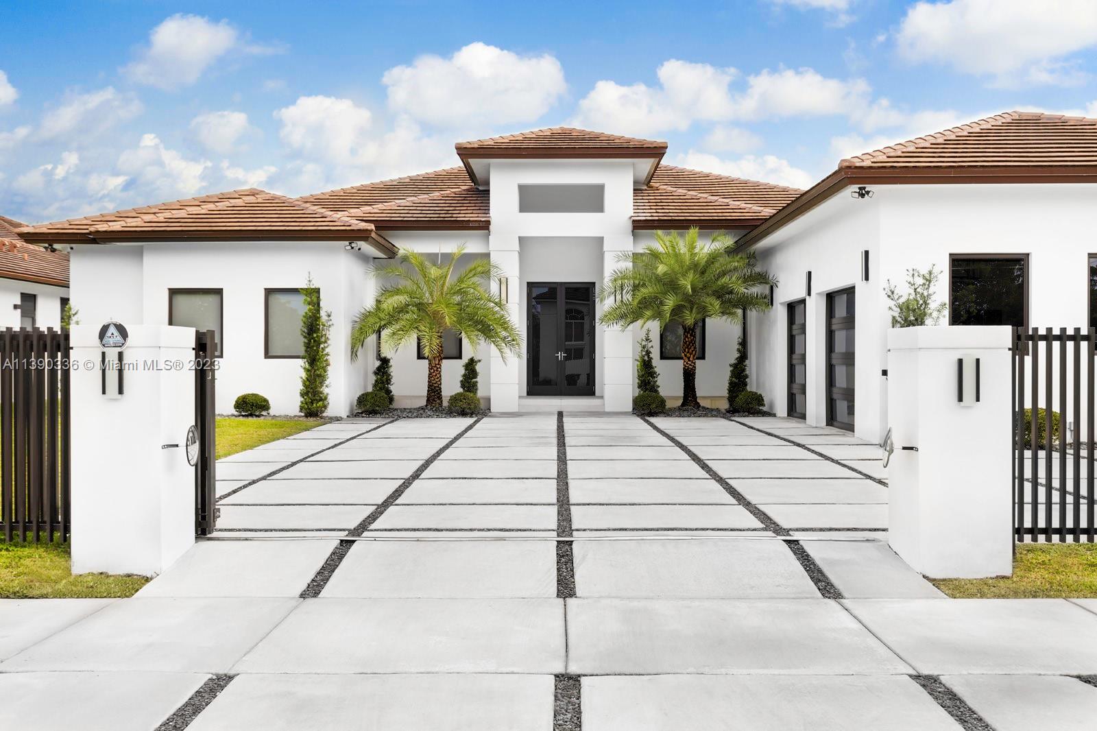 This gated luxury oasis, modern contemporary design home was completed in 2021 and offers an unparalleled living experience. Indulge in the epitome of luxury with breathtaking design and meticulous attention to detail. Enjoy the spacious and open design featuring 5 bedrooms/5 baths perfectly crafted for relaxation and privacy. Step into a gourmet chefs kitchen equipped with Thermador appliances and sleek finishes. Unwind in the opulent master suite featuring a spa-like ensuite bathroom. The outdoor oasis boasts a private pool and spa, a covered patio for seamless indoor-outdoor living. Interior features included custom built closets, vaulted ceilings, marble flooring, high impact glass and doors. Experience the ultimate luxury lifestyle in this remarkable Miami residence. Welcome home!