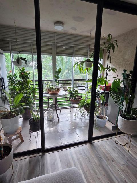 Photo of 8150 W Mcnab Rd #304, Tamarac, FL 33321 (MLS # A11890684)