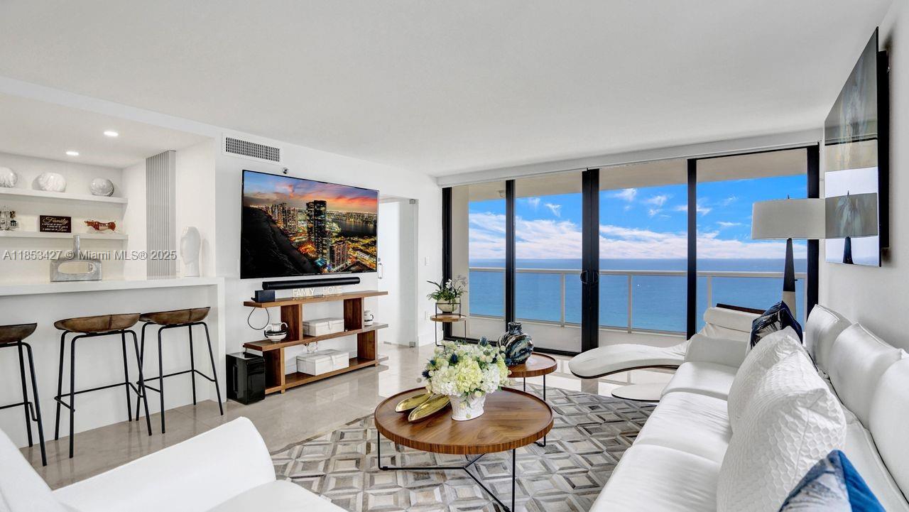 Stunning 1,980 SQFT, 3-bedroom, 2.5-bathroom condo, offering unobstructed east-ocean views. This fully remodeled residence showcases luxurious 36"x 36"marble flooring with soundproofing, a modern custom-designed kitchen, brand-new JennAir appliances, and elegant new electric shades throughout. The bathrooms have been upgraded with sleek contemporary fixtures, new toilets, and bidet, & in-unit laundry room. The building is located on the iconic Millionaire’s Row—directly on the ocean and just minutes from the prestigious shops of Bal Harbour. Residents enjoy a wide range of upscale amenities, including 24-hour security, valet parking, two swimming pools, a Jacuzzi, spa, state-of-the-art fitness center, BBQ/picnic area, a kid’s playroom & direct access to the beach and boardwalk.