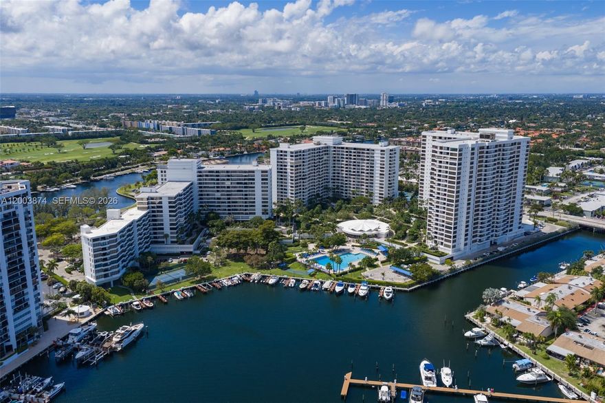 SPECTACULAR SUNSET VIEWS | OLYMPUS CONDO | 2 BED / 2 BATH | 1,400 SQ FT 
STAGED APARTMENT
Experience breathtaking sunsets from this magnificent split-floor plan residence at the prestigious Olympus Condo in Three Islands—an exclusive, private waterfront community just minutes from the beach, shopping, and dining. This spacious 2-bedroom, 2-bathroom residence is currently configured as a 1-bedroom + den, with an easy conversion back to a full 2/2. Enjoy 180° unobstructed views of the canal, marina, Diplomat Golf Course, and city skyline from a bright, open layout filled with natural light. The unit offers exceptional storage, including walk-in closets.
Meticulously maintained original, with the opportunity to customize to your taste.
Motivated seller! The current assessment will be paid in full at closing—adding immediate value.
Resort-style amenities include: a state-of-the-art fitness center with Wi-Fi, two heated pools, and a sauna, five tennis courts, Lush landscaped grounds, BBQ & picnic areas, Marina access.
Residents enjoy a complimentary shuttle service.
Prime location within walking distance to beaches, restaurants, and shops.
Investor-friendly: Can be rented immediately. The building has already passed the 50-year recertification.
Don’t miss this opportunity to own in one of the area’s most desirable waterfront communities!
