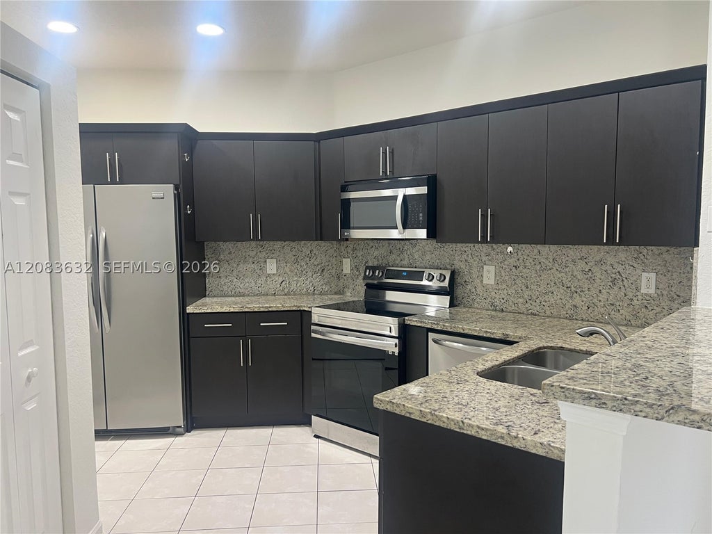 Photo of 9040 NW 54th St #9040, Sunrise, FL 33351 (MLS # A12083632)