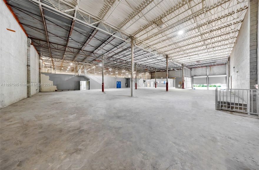 Located in the vibrant heart of Doral, this property offers an exceptional freestanding warehouse opportunity. Spanning almost 28,000 square feet of land with a substantial 20,000 square feet of building space, this property is ideally situated on a prominent corner lot. The warehouse features two dock-high doors, 22-foot clear height ceilings, and a spacious layout designed to accommodate a variety of industrial and commercial uses.The property is equipped with 23 parking spots, five bathrooms, and three modern AC units installed in 2018, ensuring a comfortable environment year-round. Additionally, the warehouse includes 14 well-appointed offices, making it a versatile choice for businesses seeking both operational space and office functionality.