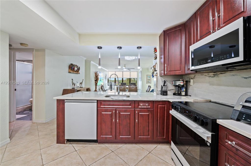 Photo of 2768 S Carambola Cir S #403, Coconut Creek, FL 33066 (MLS # A12017580)