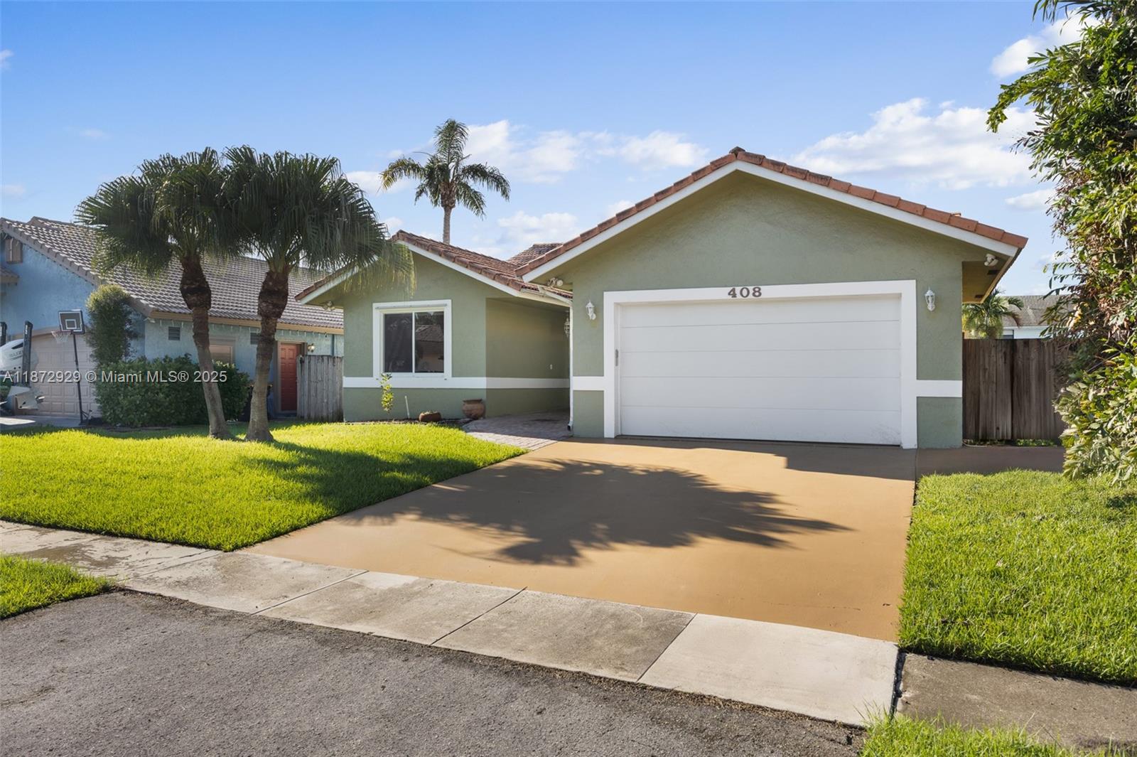 Come live on one of the most beautiful and private dead-end streets in Dania Beach. This spacious home welcomes you with soaring high ceilings, a large kitchen perfect for entertaining, three bedrooms, two full bathrooms, a formal dining room, a cozy living room with a fireplace, and a two-car garage, all finished with elegant ceramic flooring and impact windows throughout. Step outside to your own private oasis with a sparkling pool and a fully fenced backyard, ideal for gatherings, BBQs, kids, and pets. The location is unbeatable—only one mile from Fort Lauderdale International Airport and the beach, I-95, and Dania Pointe, the vibrant shopping and dining destination. This home combines privacy, comfort, and convenience in one of the most desirable areas of Dania Beach