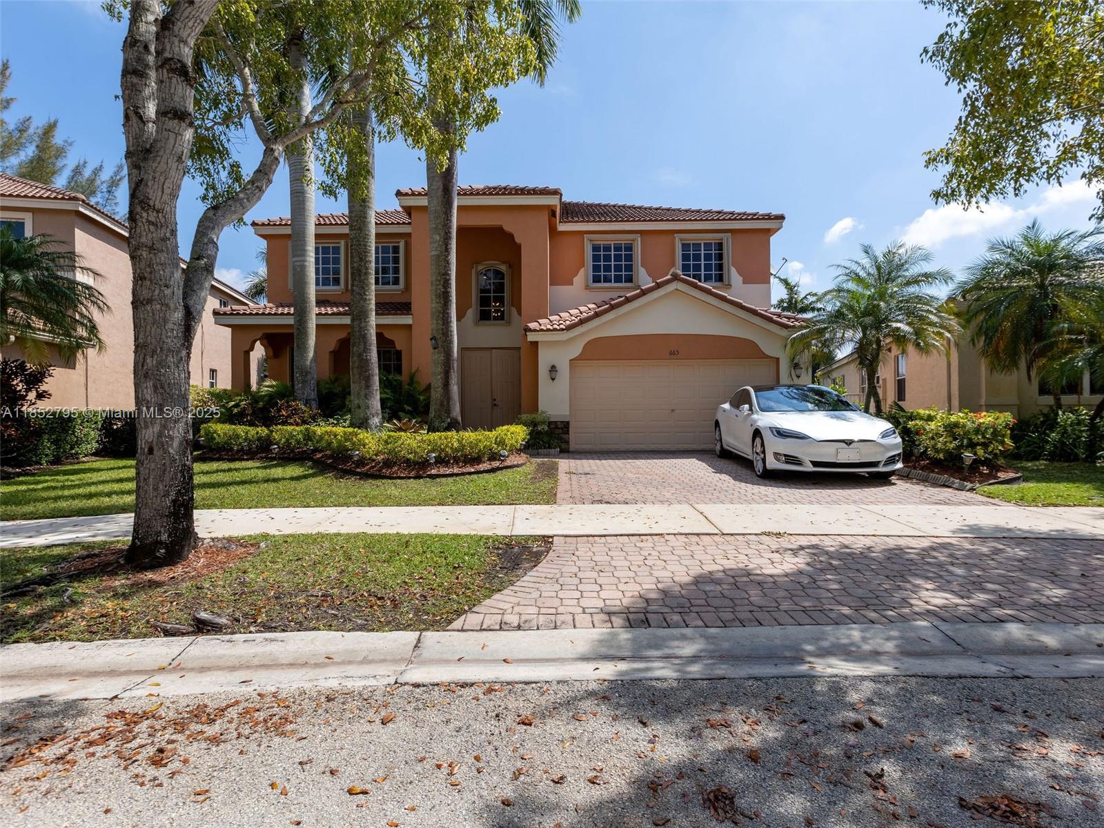 Beautiful lakefront home in Savanna featuring five bedrooms and four full bathrooms. All living areas have marble floors, while the bedrooms have wood flooring. The property includes a spacious open kitchen. Oversized 9,283-square-foot lakefront lot, providing ample room for outdoor entertaining. Enjoy breathtaking sunset views from the comfort of your home. A new roof was installed in 2024, and the interior is painted in natural colors throughout. The huge family room adds to the appeal of this well-maintained home, which also features accordion shutters.