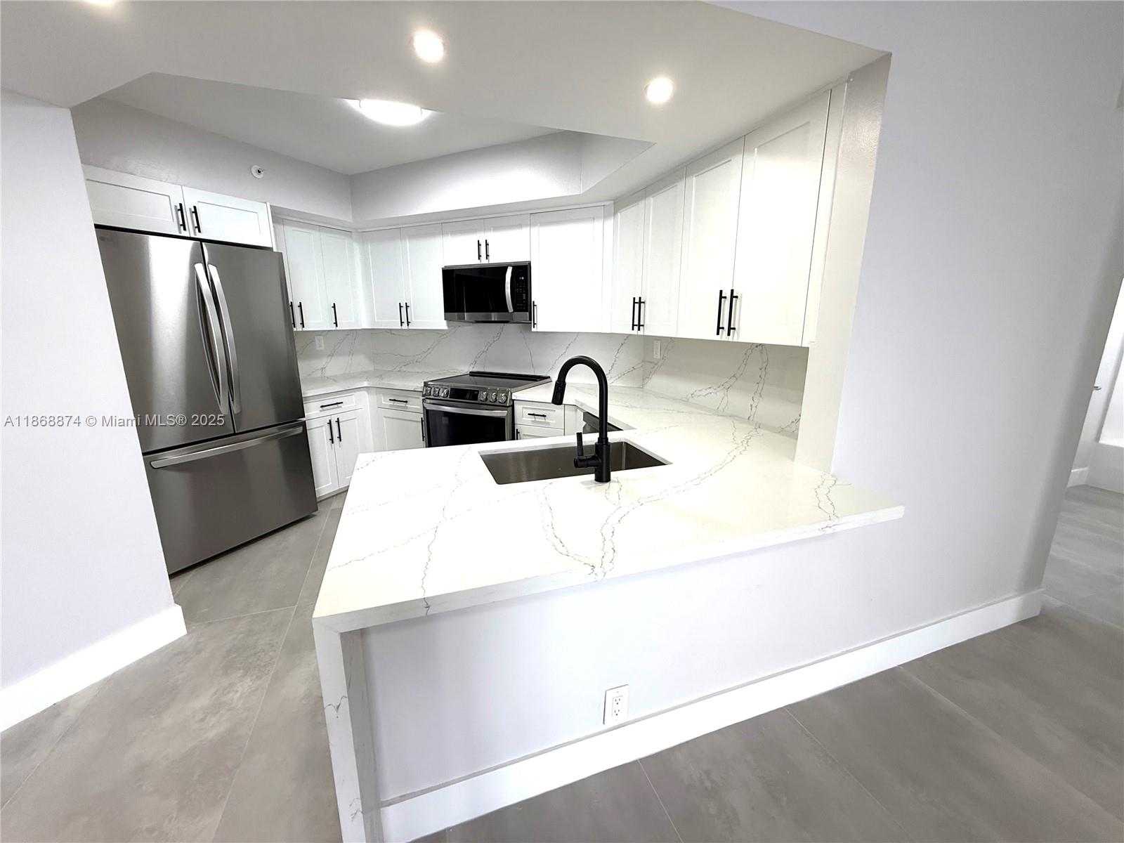 Completely renovated 2 bed,| 2 bath unit with partial ocean views. This bright, spacious home features stainless steel appliances, sleek slate tile, and new motorized and hurricane shutters. Enjoy the convenience of an in-unit washer and dryer and two balconies with desirable West and Southeast views. The Sterling Condo elevates your lifestyle with a waterfront pool, sauna, fitness center, and direct beach access. Just a short walk to restaurants and shops, this is the epitome of luxurious coastal​​‌​​​​‌​‌​​​‌‌​​​‌‌‌​​‌​​‌‌​​​​ living.