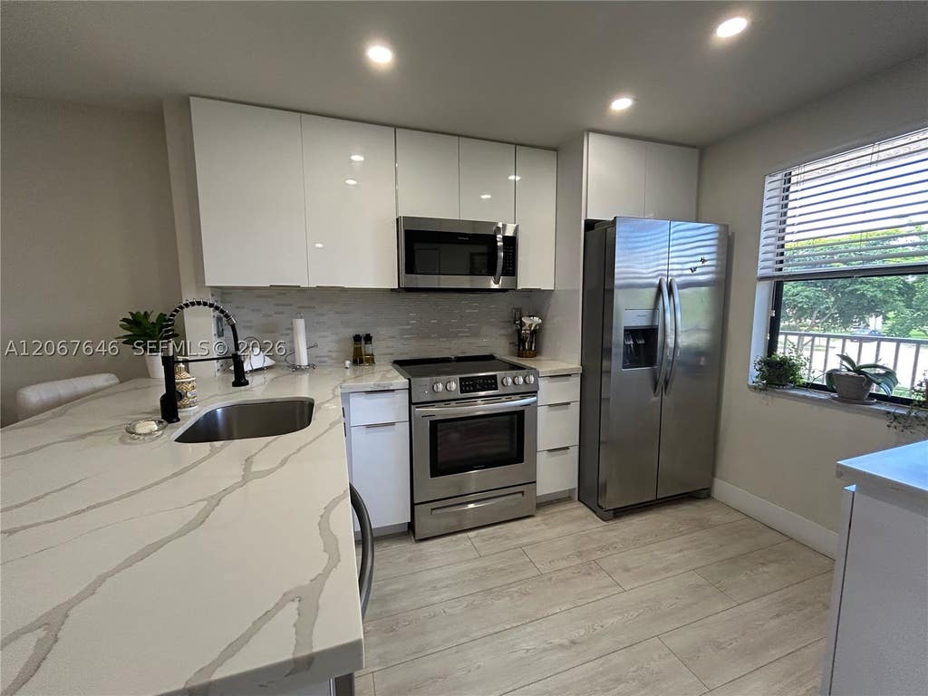 Photo of 10130 Sunrise Lakes Blvd #207, Sunrise, FL 33322 (MLS # A12067646)