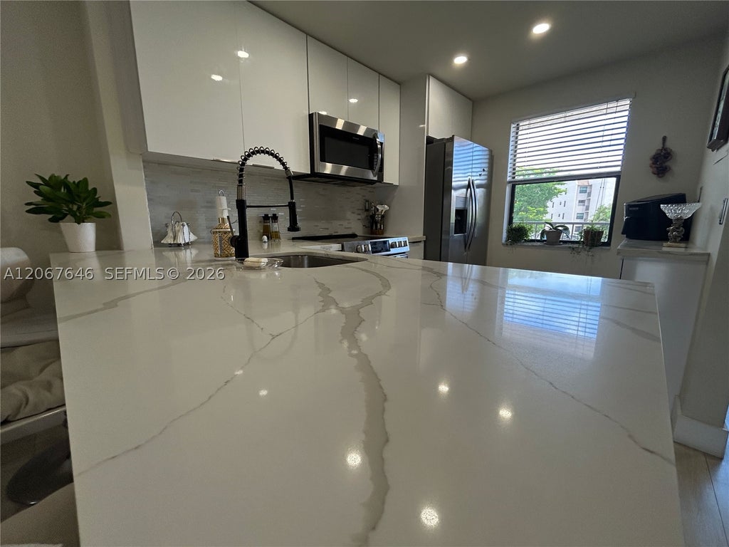 Photo of 10130 Sunrise Lakes Blvd #207, Sunrise, FL 33322 (MLS # A12067646)