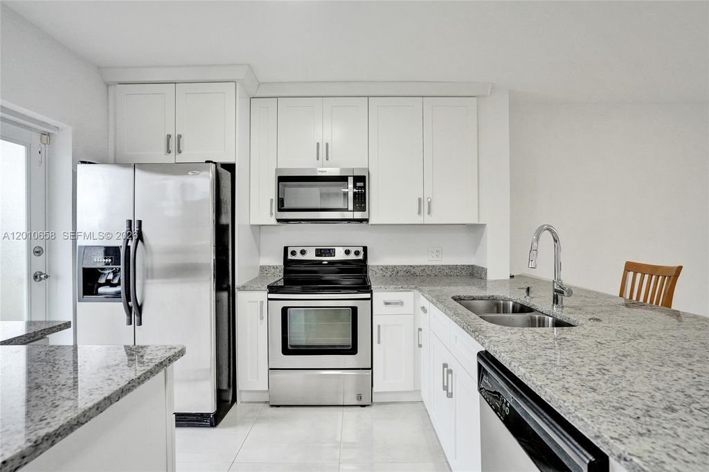 Photo of 5950 Del Lago Cir #104, Sunrise, FL 33313 (MLS # A12010658)