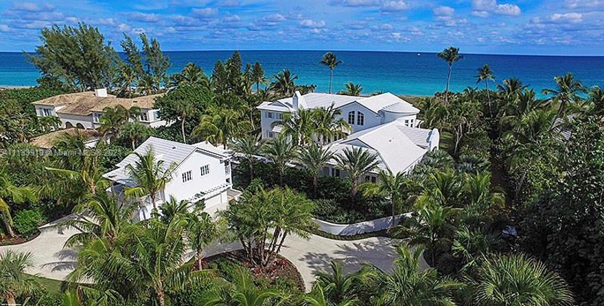 Be amazed at the impeccable workmanship of this exquisitely re-designed oceanfront home! The 2-story, 5-bedroom, 6.5 bath structure has been meticulously transformed into a contemporary Bermuda work-of-art. Literally everything is brand new! Attractive white tongue & groove walls and ceilings along with Shellstone floors found throughout the house, accentuate the beauty of the richly-stained wood beams at the entry hall, living room and above the dramatic circular stairway. Situated to the left of the foyer there is a private guest wing housing 3-bedrooms, 3 full baths and access to the pool area. The living room is if considerable proportion and features a 2-story cathedral ceiling, eye-catching wall of Mesozoic Limestone with cantilevered shelves and a massive inset TV screen.