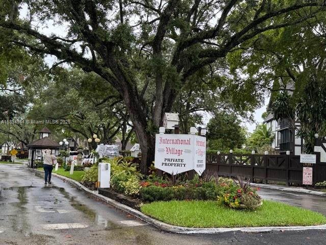 Spacious first-floor 2/2 unit is located in the gated, European-style community of International Village, offering resort-style living just minutes from major highways, shopping, dining, and everyday conveniences. The unit features laminate flooring and an original kitchen and bathrooms, complemented by a private patio with garden view. Residents enjoy a wide range of amenities, including a clubhouse, two pools (one indoor heated), two hot tubs, a fully equipped gym, sauna, five tennis courts, a billiards room, BBQ area, golf practice zone, and a pickleball court coming soon. Emotional support pets are welcome. The community provides 24-hour guarded entry with patrolling security, assigned parking, and guest parking. PARKING Y11.