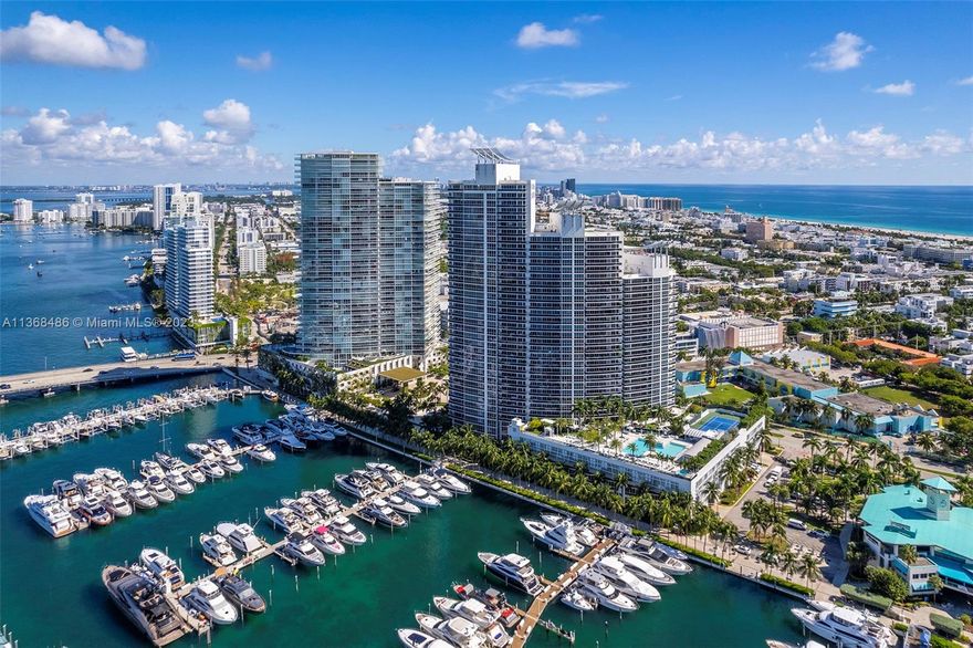 Come home to a sophisticated coastal lifestyle. Escape to a luxurious SoFi retreat with stunning ocean and bay views in this waterfront 2/2.5 at Murano Grande. Flooded with natural light, this unit boasts a spacious, open floor plan. Revel in 20th floor bay and ocean vistas from 2 balconies accessible from both bedrooms and living area. Enjoy top-notch Miele and subzero kitchen appliances accompanied by a convenient laundry room. The master suite features a walk-in closet and spa-inspired Lux master bath with double sinks, soaking tub, and stone shower. Both bedrooms feature blackout window treatments and hardwood floors. Building amenities abound with a semi-private elevator, tennis court, bayfront pool, spa, restaurant, fitness center, media room, and 24/7 valet and concierge services.