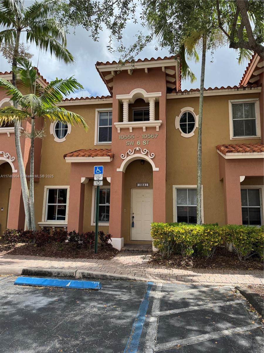 Nestled in a gated community in the heart of Pembroke Pines, this charming townhouse condo offers both comfort and convenience. The first floor features elegant tile flooring, while the second floor showcases recently installed wood floors. Upstairs, you'll find two spacious master bedrooms, each with a walk-in closet. Additional highlights include two assigned parking spaces, a newer washer and dishwasher, and updated A/C coils. Enjoy the privacy of your own backyard—an ideal space to relax or entertain. A perfect starter home!