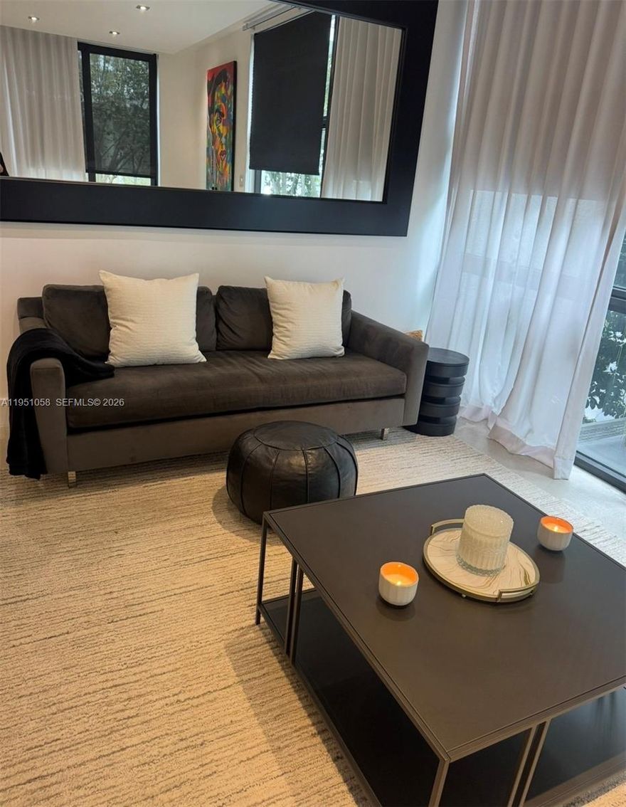 This turn-key gated townhome residence offers a bright and inviting layout with an abundance of natural light and thoughtfully designed throughout. Nestled on a quiet, tree-lined street, yet just moments from Lincoln Road, Sunset Harbor, beaches, dining, and shopping.  Perfect as a primary residence, second home, or investment opportunity. Enjoy the convenience of a boutique building in one of Miami Beach's most desirable neighborhoods.  A fully renovated 3 story corner townhome with a private roof top terrace, spacious 4-bedroom,  3.5 bath residence includes a separate studio, offering exceptional flexibility for guests, or home office.  The residence features polished concrete floors throughout , custom built-ins, and a gourmet kitchen equipped with top of the line appliances. 
The outdoor flow leads to a private -and secluded retreat, ideal for gatherings or quite enjoyment.
*Additional enhancements and upgrades have been completed throughout the residence. Included in the square footage is a studio with a kitchenette and bathroom, which was converted from the original garage and has a separate entrance. The square footage and additional 1 bed/1 bath are not reflected in the county records, which reflects the townhouse only without the studio, at 3b/2.5ba and 2167ft