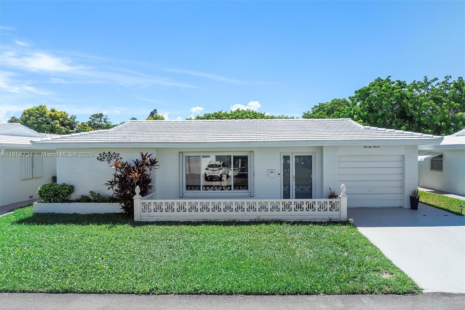 This spacious 2-bedroom, 2-bath home offers 1,832 sq. ft., making it one of the largest models in the 55+ neighborhood. The open concept layout flows into a wide panoramic waterway view, creating a bright and airy feel. A generous Florida room provides extra living space, while the screened porch is perfect for enjoying the outdoors in comfort. The primary bedroom features a large walk-in closet, and the garage includes built-in, doored storage for easy organization. Enjoy relaxing on the shaded front porch or take advantage of the community amenities, including a clubhouse, exercise room, and pool. Mortgage savings may be available for buyers of this listing.