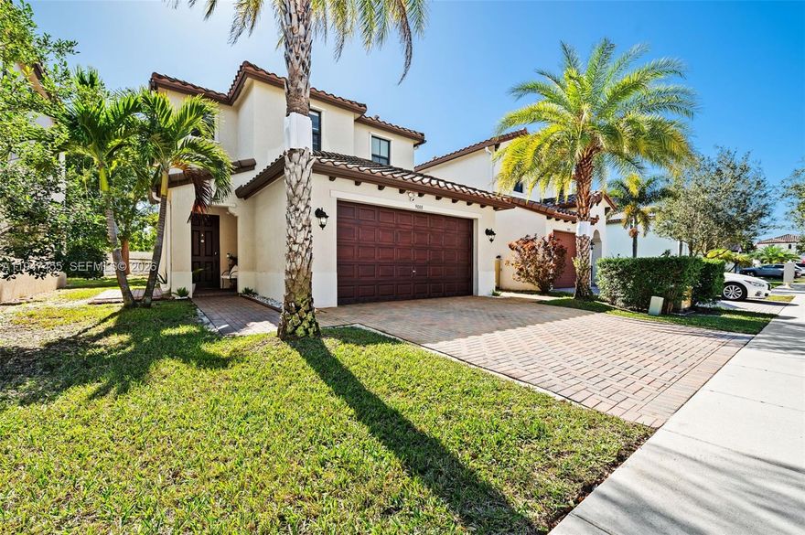 Welcome to this beautifully upgraded 3-bedroom, 2.5-bath single-family home in a gated community with a low $140/month HOA. Featuring the desirable Corona floor plan, this residence offers 1,891 sq ft, a 2-car garage, additional driveway parking, a dedicated laundry room, and a large walk-through pantry—designed for both comfort and functionality.

The first floor features luxury vinyl plank flooring (2023), while the second level offers laminate flooring with ceramic tile in bathrooms and laundry. The kitchen is well-appointed with 42” cabinets with crown and light rail molding, granite countertops and backsplash, stainless steel Whirlpool appliances, a breakfast bar, pendant lighting, and high ceilings. Major upgrades include a new A/C compressor (2023), impact hurricane windows upstairs, shutters downstairs, gutters throughout, extended pavers, and a whole-house carbon water filtration system.

The fully fenced white vinyl yard with palm trees creates a private outdoor retreat. The primary suite includes crown molding with LED accent lighting, dual vanities, a frameless glass shower, and a private toilet area. Additional highlights include upgraded Moen fixtures, raised-height vanities, ceiling fans throughout, and window shades in every room. Conveniently located near Hard Rock Stadium, offering easy access to Formula One, major concerts, and international sporting events.