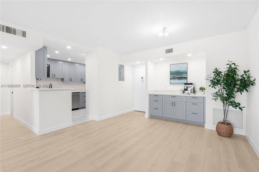 MOTIVATED SELLER!!! One of the finest apartments in the complex, fully remodeled with modern finishes throughout. This unit features a brand new kitchen, equipped with stainless steal appliances, quarts countertops and an additional bar area in living room. Beautifully designed new bathrooms, new laminate flooring, impact windows, baseboards, recessed lights, stylish shades, and more add to its appeal. The enclosed balcony provides a versatile space, perfect for a home office or relaxation area. The apartment includes extra storage, one assigned parking space, and the option to lease an additional parking spot for a fee. Ideally located near major roads, shopping centers, and everyday conveniences. Make an offer today!