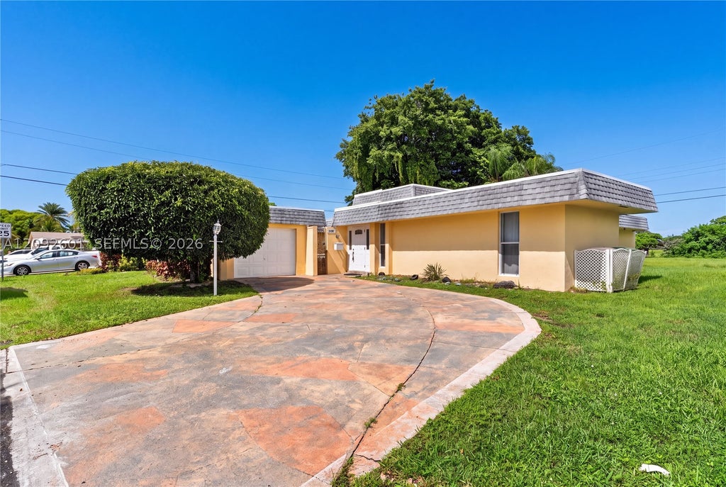 Photo of 5405 Bayberry Ln, Tamarac, FL 33319 (MLS # A12092601)
