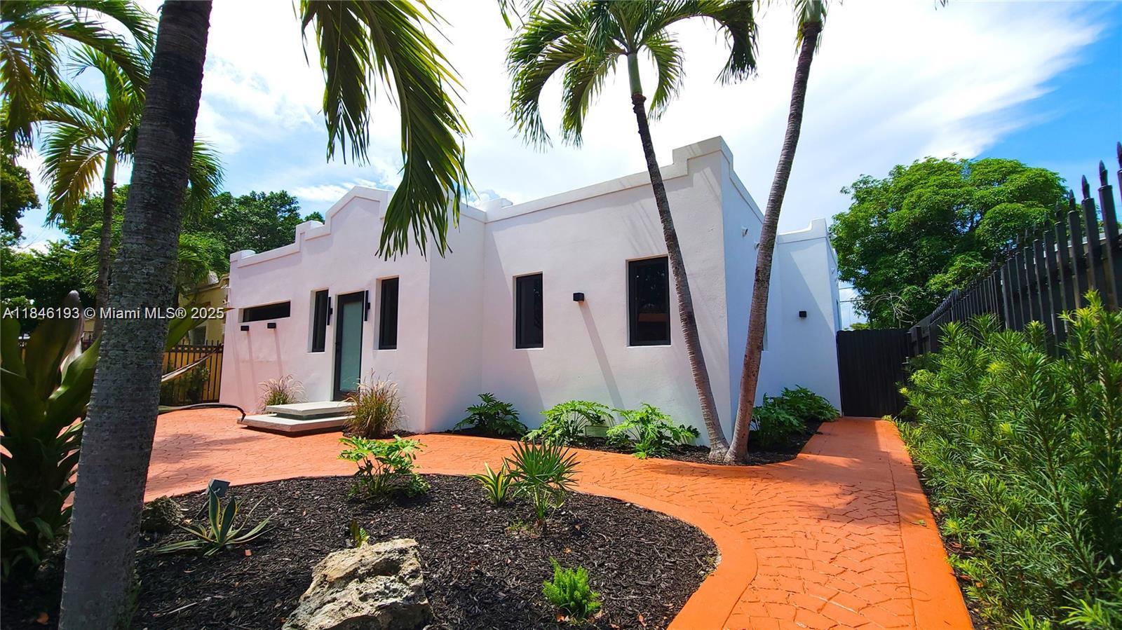 Welcome to a fully remodeled 5bed/3.5bath home with detached in-law suite in central Miami! Gated entry leads to a landscaped yard and private driveway. Main home features a bright open layout, new flooring, modern kitchen with custom cabinetry, sleek bathrooms, and premium finishes throughout. Detached 1bed/1beth in-law suite includes a private entrance, kitchenette, and full bath—perfect for guests, extended family, or studio/office space leading out to a spacious backyard ideal for entertaining. This home is beautifully well-lit at night for added comfort and security. Located directly across from Charles Hadley Park—the only park in the area with an Olympic-size pool. Minutes to Wynwood, Midtown and Design District. A rare turnkey opportunity offering versatility in a prime location!